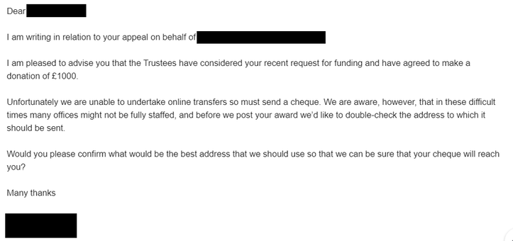 Screenshot of an email received from a small family trust offering a grant of £1,000